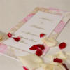 Pink rose edged order of service
