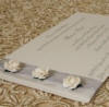 Cream roses on silver ribbon wedding invitation
