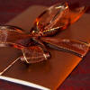 Cream and brown wedding invitation with ribbon detail